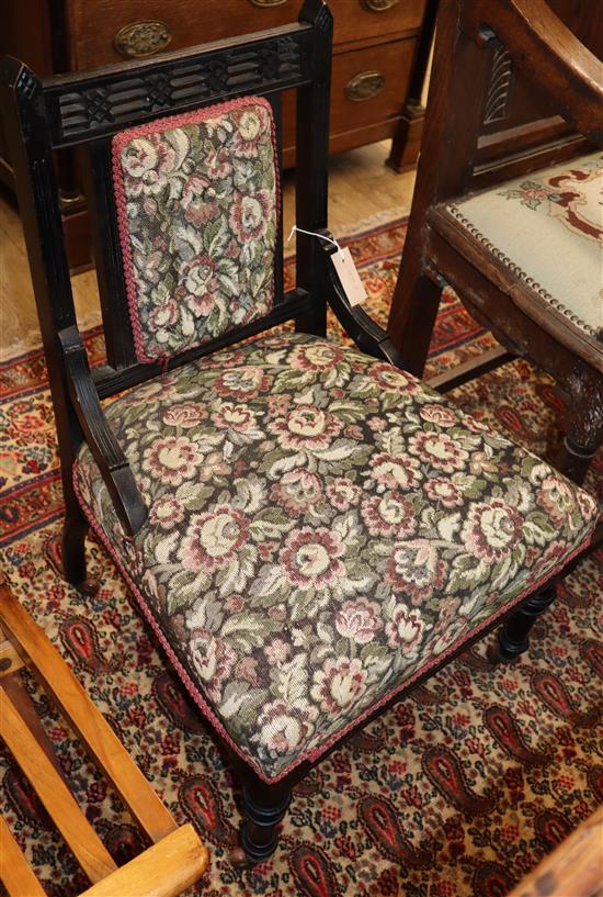 An ebonised Arts and Crafts nursing chair